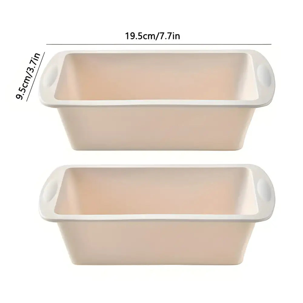 Two beige nonstick silicone loaf pans for baking delicious Christmas cookies