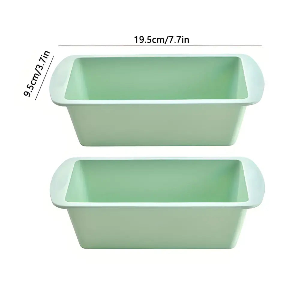 Two light green nonstick silicone loaf pans perfect for baking Christmas cookies