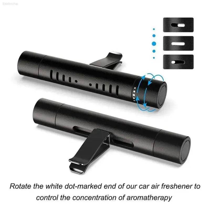 Black cylindrical car air freshener with adjustable vent clip.