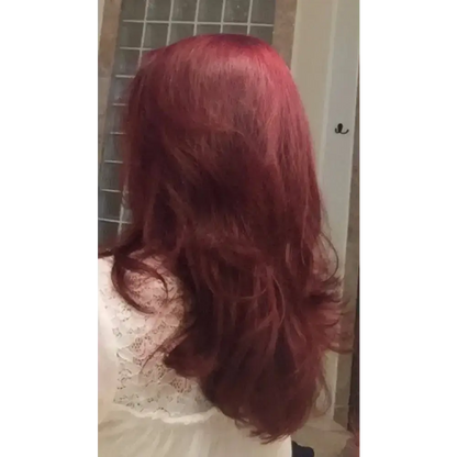 Long, layered red hair showcasing Organic Caffeine Hair Growth Explosion for healthy hair