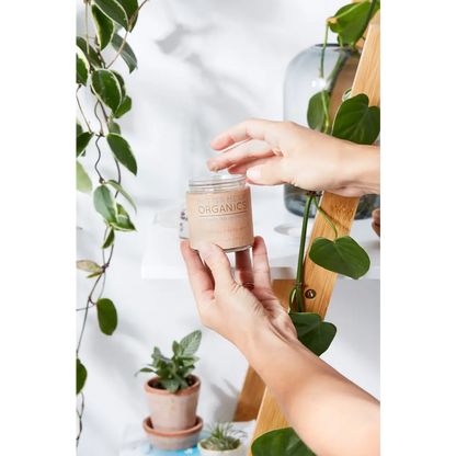 Glass jar with a brown label for Organic Deodorant Soothes Sensitive Skin