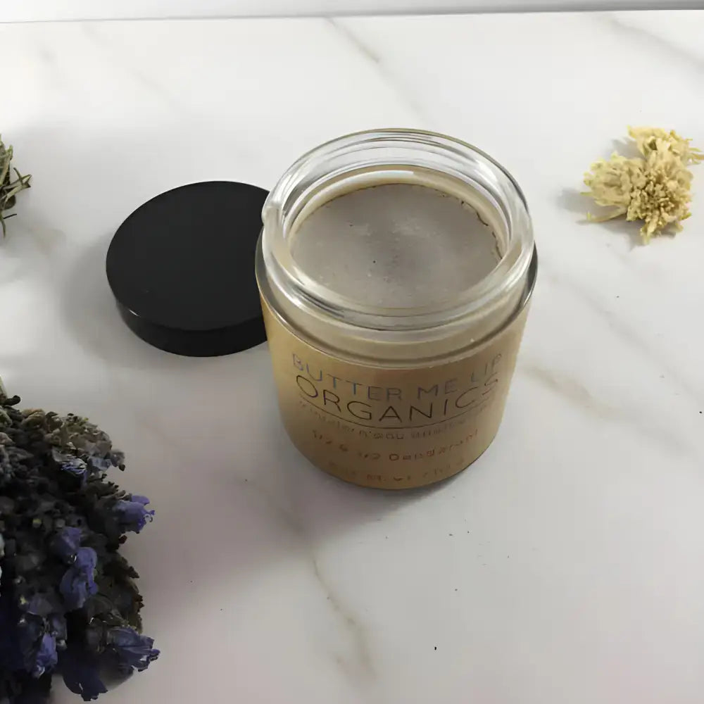 Open jar of organic face cream next to Organic Deodorant Soothes Sensitive Skin