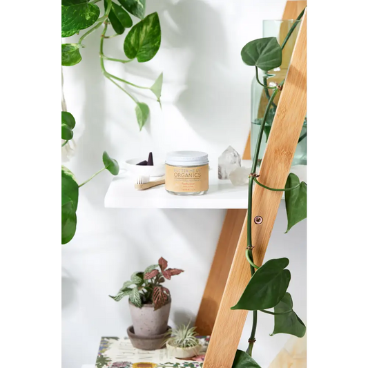 Jar of Organic Face Cream next to Organic Whitening Toothpaste with Rosemary Essential Oil