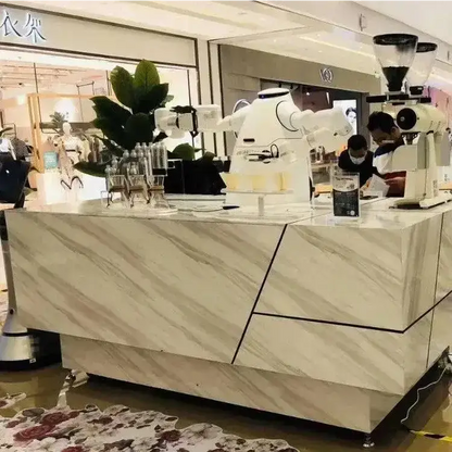 Marble-patterned coffee bar with Orionstar robot serving coffee using dual arms