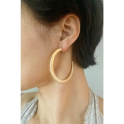 Gold hoop earrings from Overall Luxe Round Hoop Earrings collection, perfect for any outfit