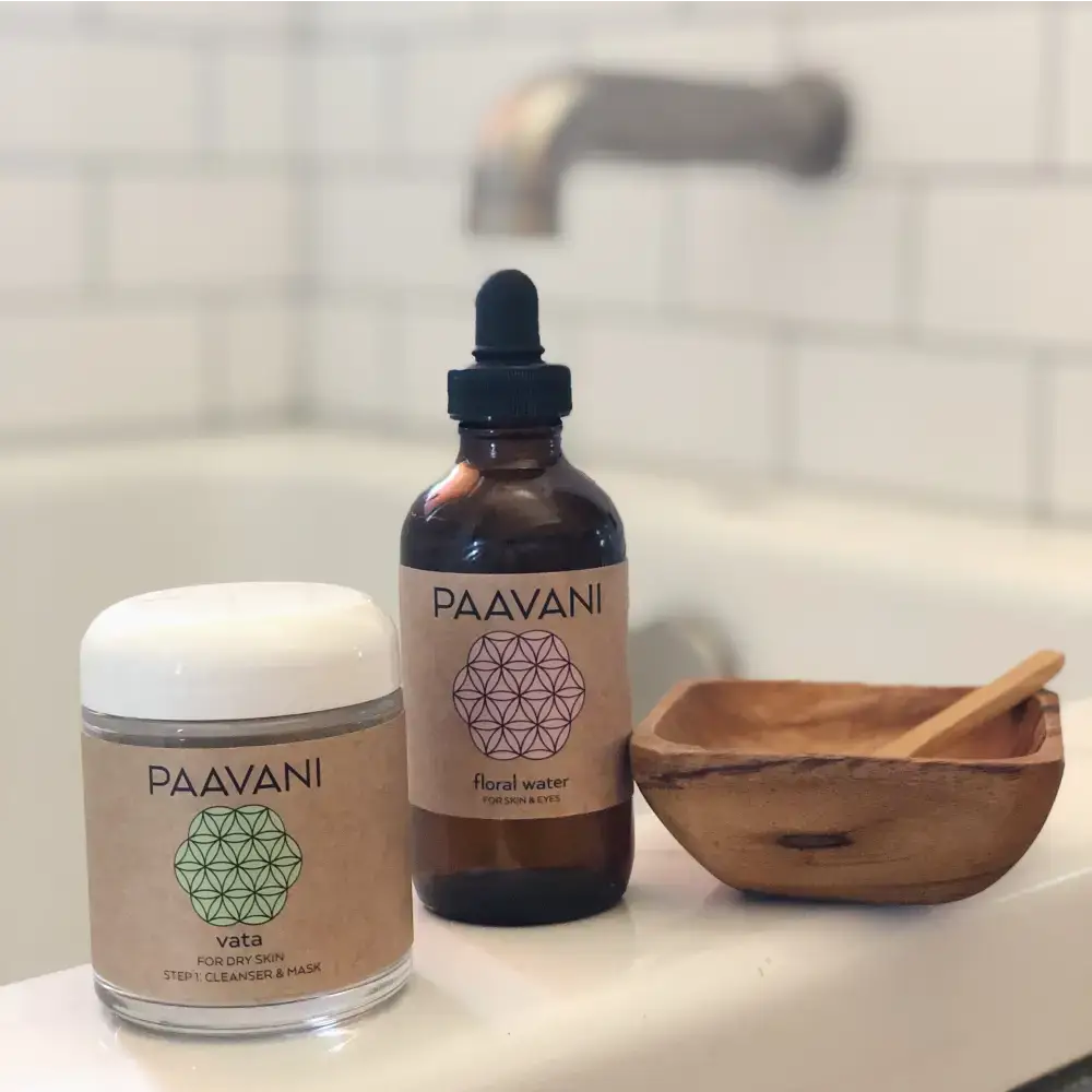 Skincare products with Paavani Mask Ritual Kit and compostable refill in a wooden bowl