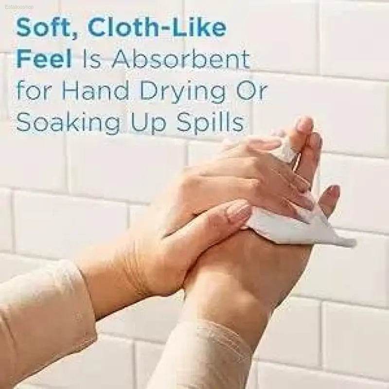 Hands drying with absorbent cloth.
