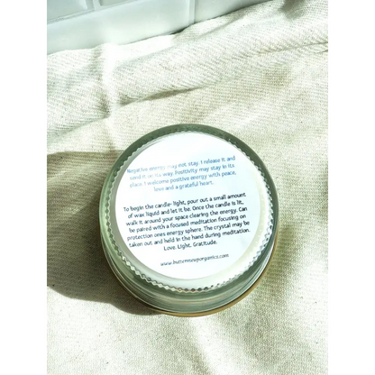 Candle with instructions on lid from Palo Santo Space Clearing Candle Shelf Set