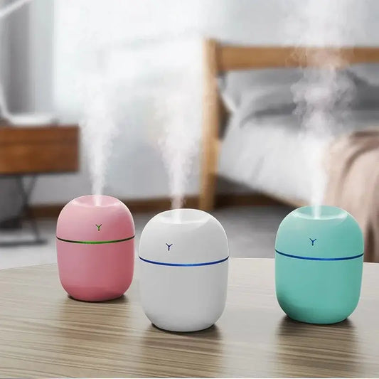 Three colorful Pastel USB Aroma Essential Oil Diffusers emitting soothing vapor