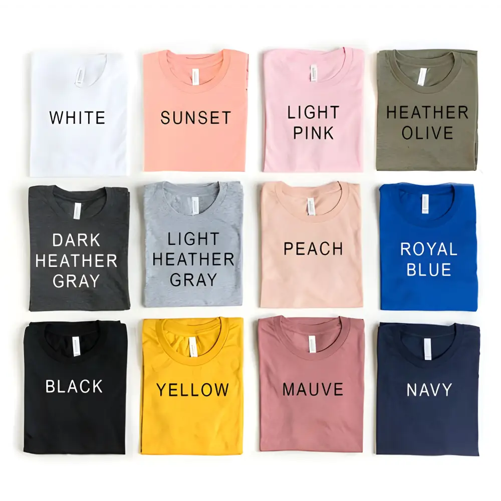 Assorted folded t-shirts in Heather Gray Sold and Light Pink Sold styles