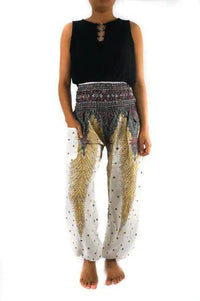 Slay the Boho Scene: Bold Black Top and Patterned Harem Pants - Estalios