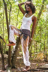 Slay the Boho Scene: Bold Black Top and Patterned Harem Pants - Estalios