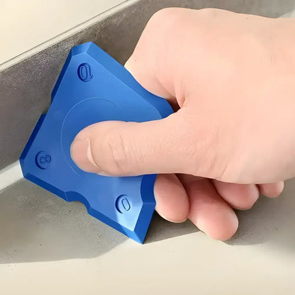 Blue triangular silicone caulking tool from the Perfect Finish Caulking Tool Set