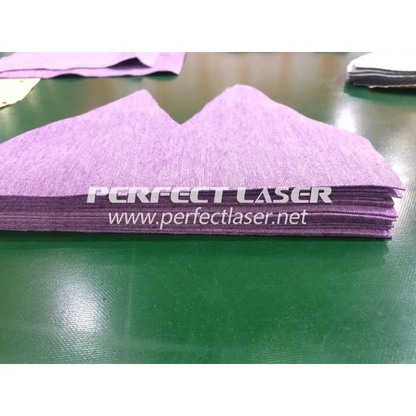 Stack of purple fabric cutouts created by Perfect Laser Automatic Fabric CNC Cutter