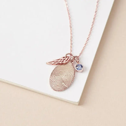 Personalized Rose Gold Fingerprint Necklace showcasing unique fingerprint jewelry design