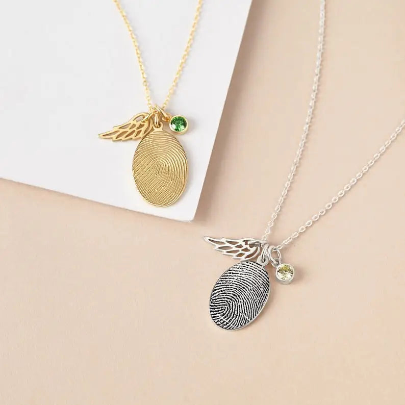 Two fingerprint necklaces in Rose Gold with wing and gemstone charms, perfect fingerprint jewelry