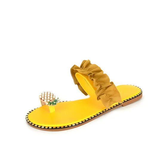 Bright yellow Pineapple Pearl Beach slides featuring ruffled strap and pineapple detail