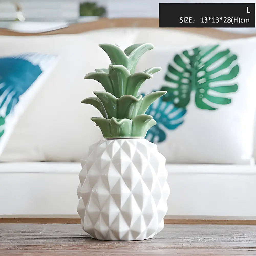 White ceramic pineapple sugar bowl with green top, perfect for charming storage jars