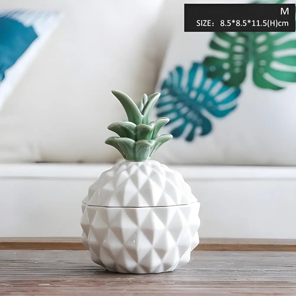 White ceramic pineapple sugar bowl with green top, perfect for stylish storage jars