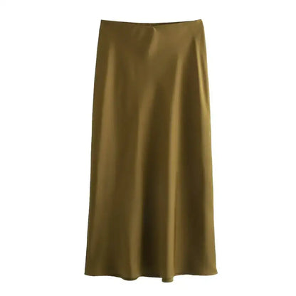 Olive green satin midi skirt styled with a Navy Blue top for effortless chic vibes