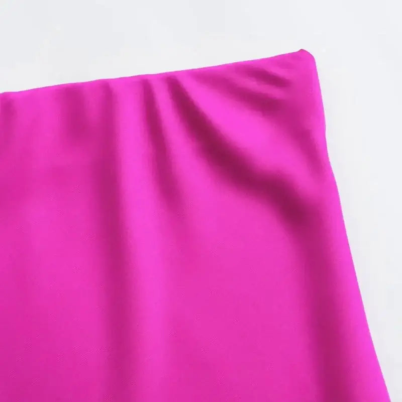 Fuchsia fabric with slight wrinkles on a Navy Blue Midi Skirt showcasing stylish colors