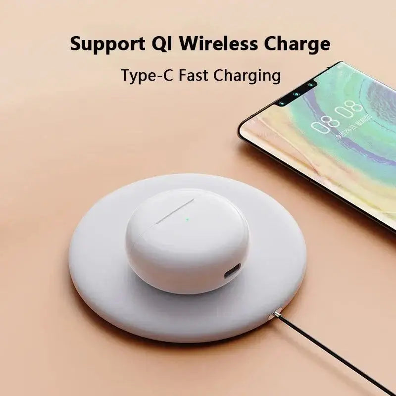 White wireless charging pad with Pocket HiFi Stereo Wireless Earbuds ready to go