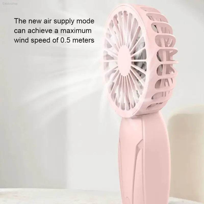Pink handheld fan.