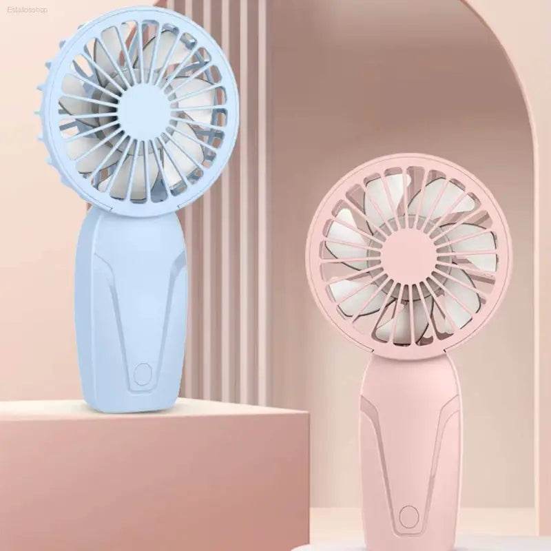 Two handheld portable fans.