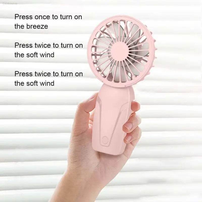 Pink handheld fan.