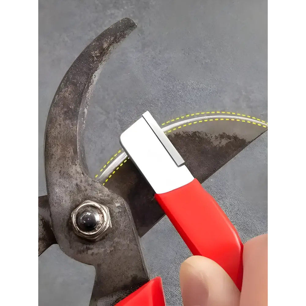 Well-worn pruning shears next to a Precision Edge Kitchen Knife Sharpener