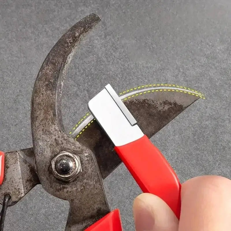 Well-used pruning shears next to a Precision Edge Kitchen Knife Sharpener