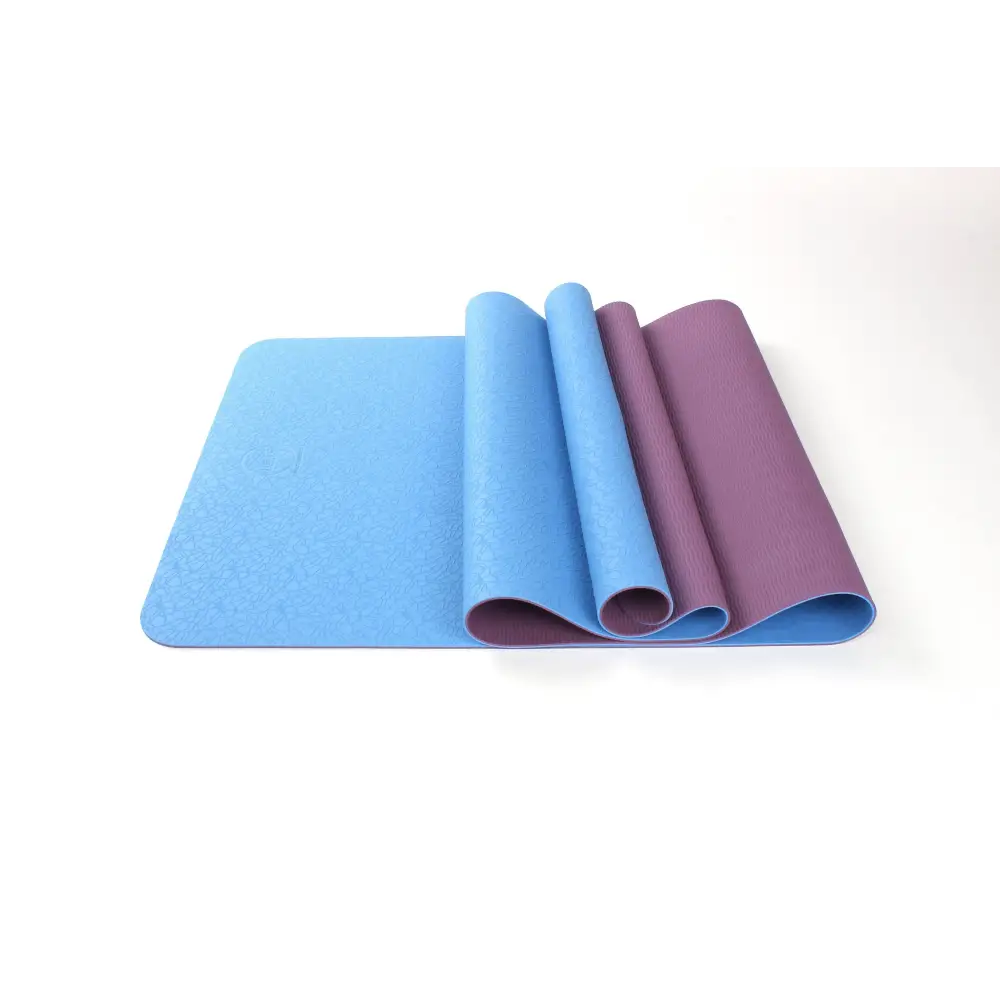 Partially rolled blue and purple TPE premium yoga mat for ultimate comfort