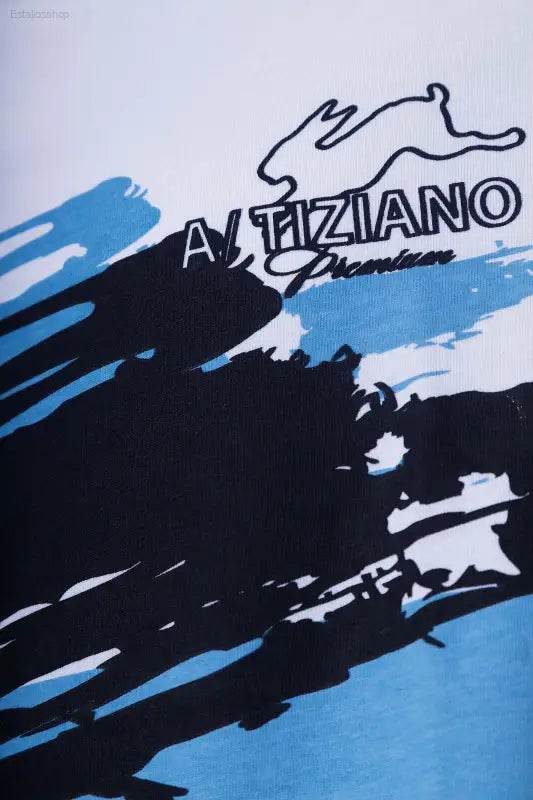 White shirt with rabbit logo and abstract design.