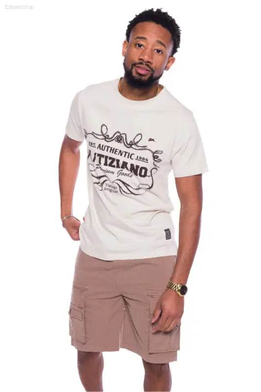 Man wearing a graphic tee and cargo shorts.