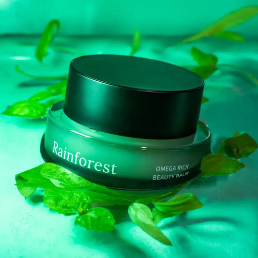 Green beauty balm jar with black lid from Rainforest Omega Rich Beauty Balm