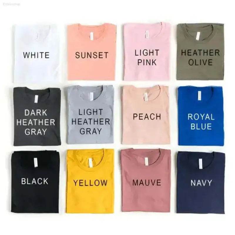 Folded t-shirts in various colors.