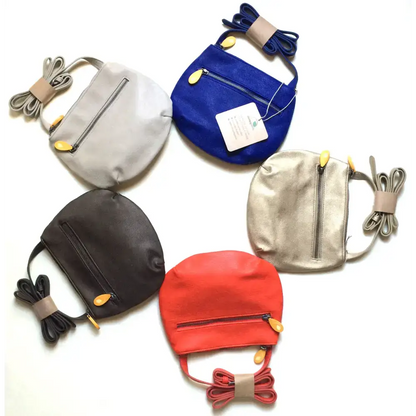 Colorful leather crossbody bags including the Royal Blue Willoughby Crossbody Bag