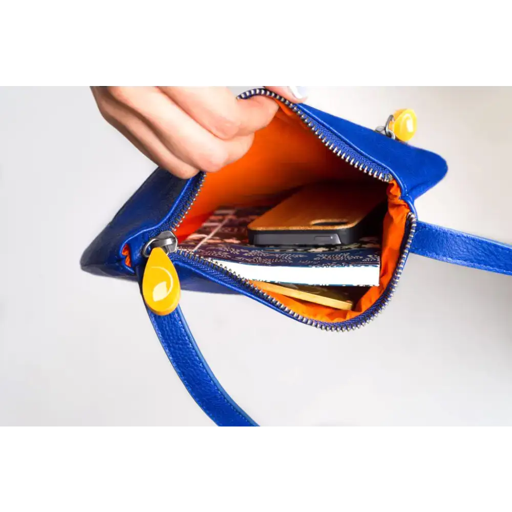 Royal Blue Willoughby Crossbody Wow bag featuring a blue leather purse with orange lining