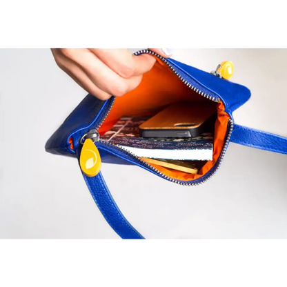 Royal Blue Willoughby Crossbody Wow bag featuring a blue leather purse with orange lining