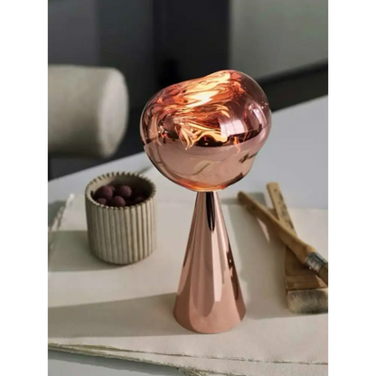 Copper-colored cone-based molten glass lamp for a stylish modern table lamp