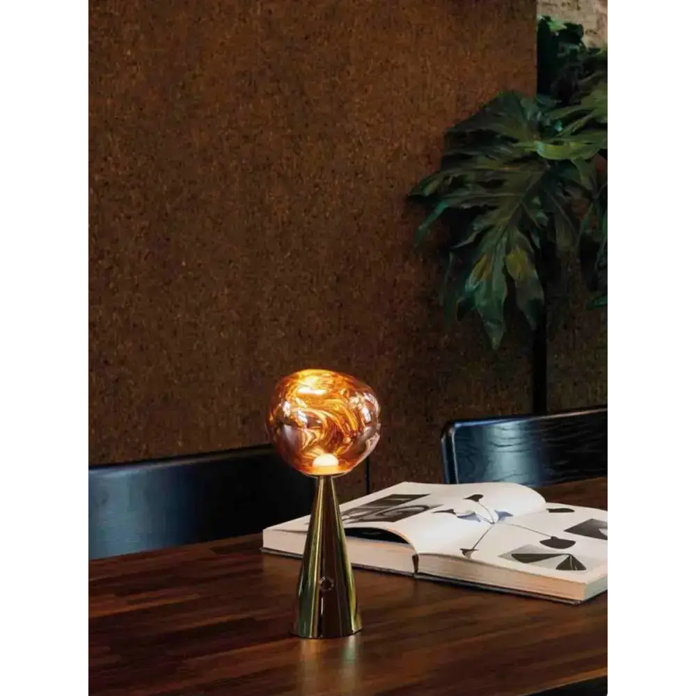 Golden lamp with marbled glass shade perfect for any Sculptural Modern Table setup