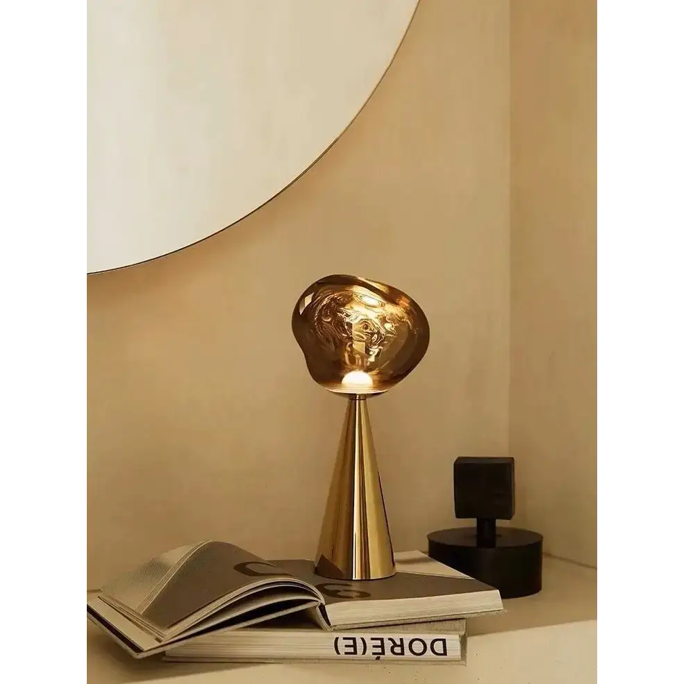 Golden molten-shaped lamp perfect for your sculptural modern table decor