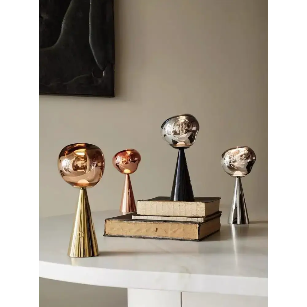 Assorted metallic decorative sculptures for a stylish sculptural modern table lamp