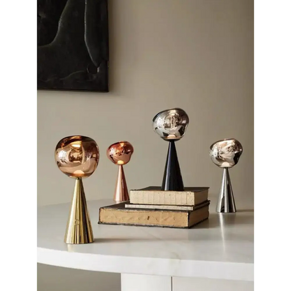 Assorted metallic decorative sculptures for a stylish sculptural modern table lamp