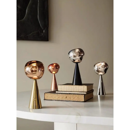 Assorted metallic decorative sculptures for a stylish modern table lamp