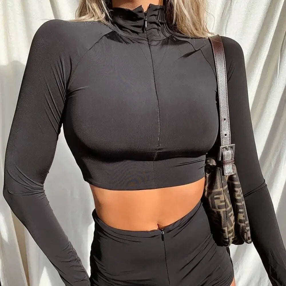 Seamless Black Yoga Set Slay features a stylish black long-sleeved crop top and shorts