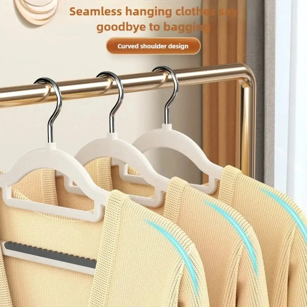 Clothes on seamless wide shoulder hangers, perfect for organizing your wardrobe at home