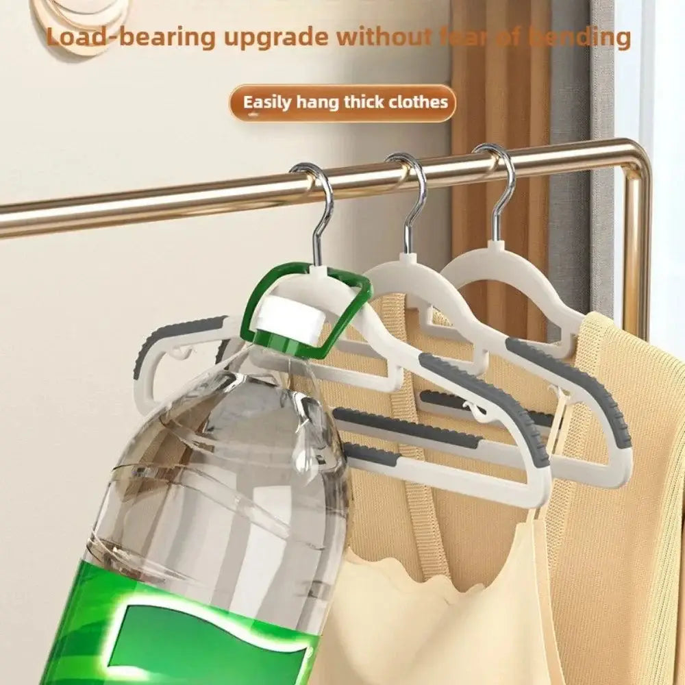 Seamless Wide Shoulder Hangers 10pcs with a water bottle for stylish organization