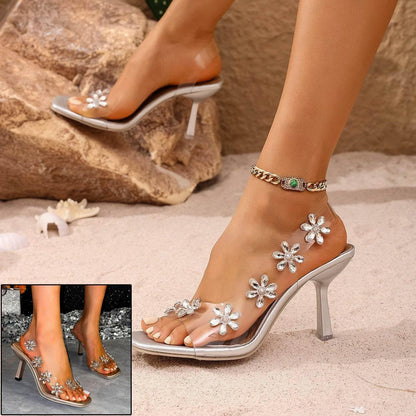 Shimmering Bloom: Chic Silver Sandals with Floral Embellishments - Estalios