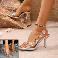 Shimmering Bloom: Chic Silver Sandals with Floral Embellishments - Estalios